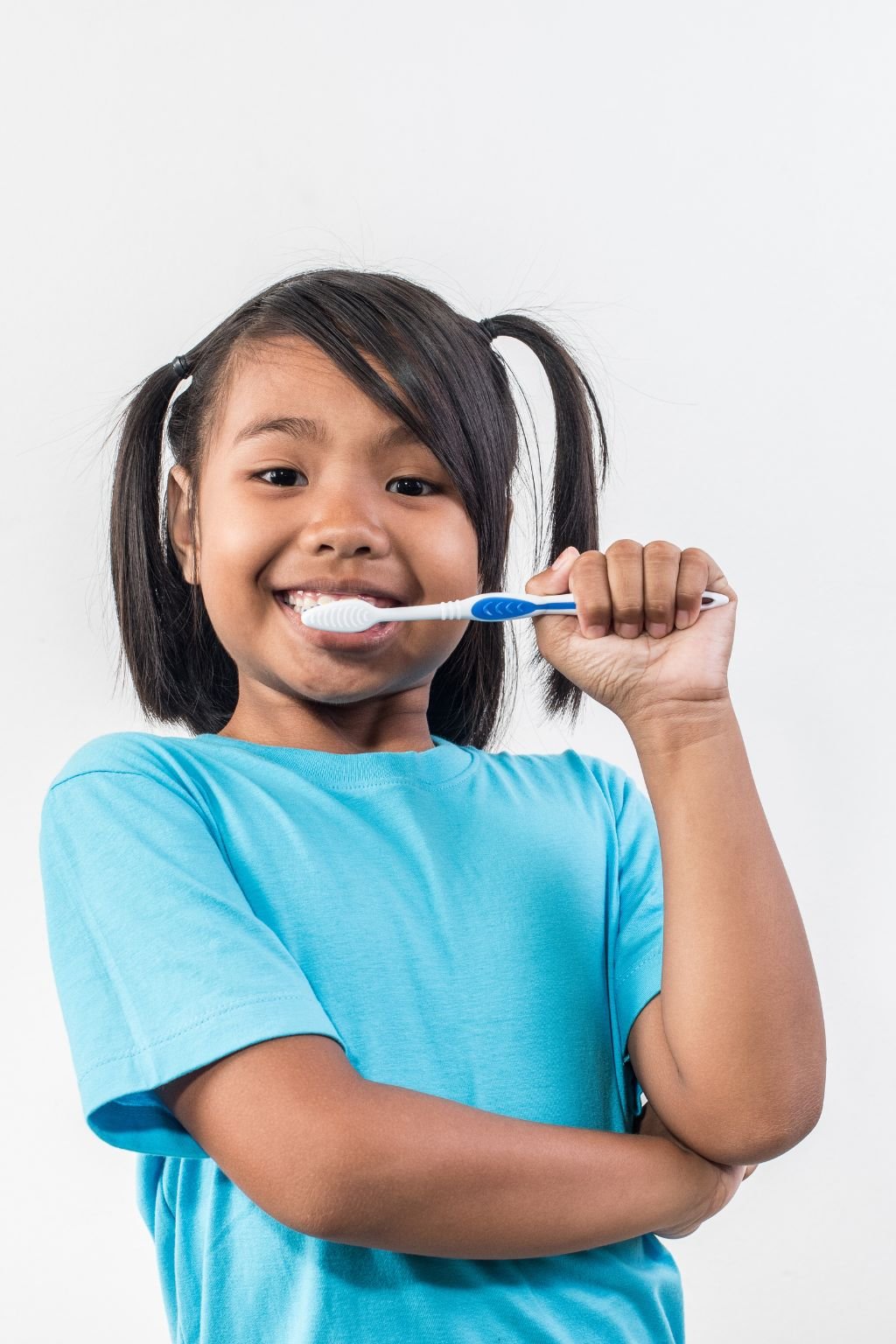 Child receiving calm, patient pediatric dental care at Umbrella Aesthetics Mysore